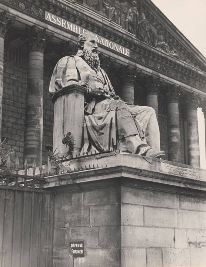A statue in front of the Assemble Nationale.