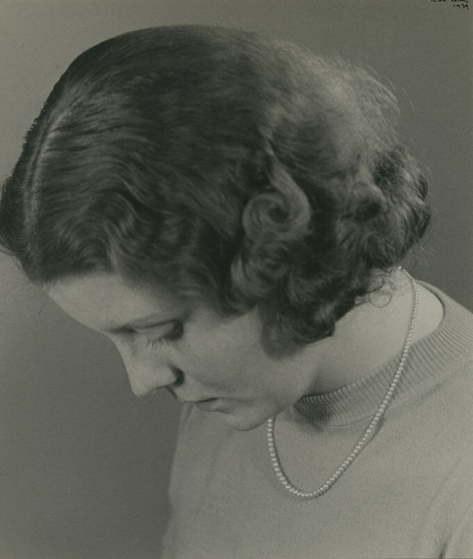 Eta Busch poses with her head down.