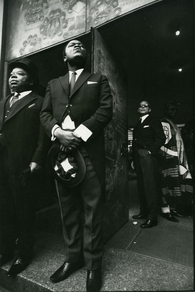 Formally dressed men stand in front of doorway, Bonn, W. Germany, 1965